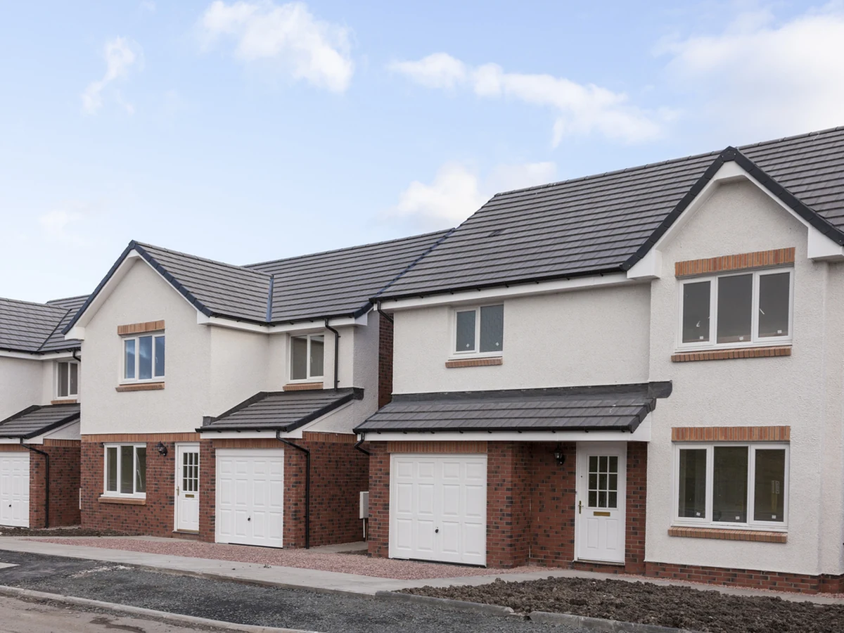 New build white rendered exterior masonry painting in Derby
