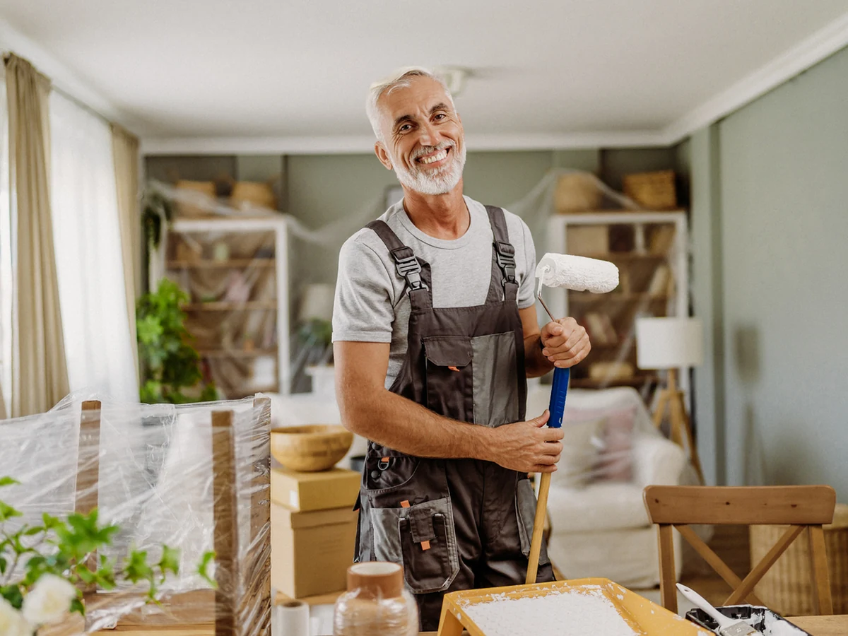 painting-decorating-older-man-holding-derby-painters Derby Painters decorator holding equipment, professional painting service in Swadlincote